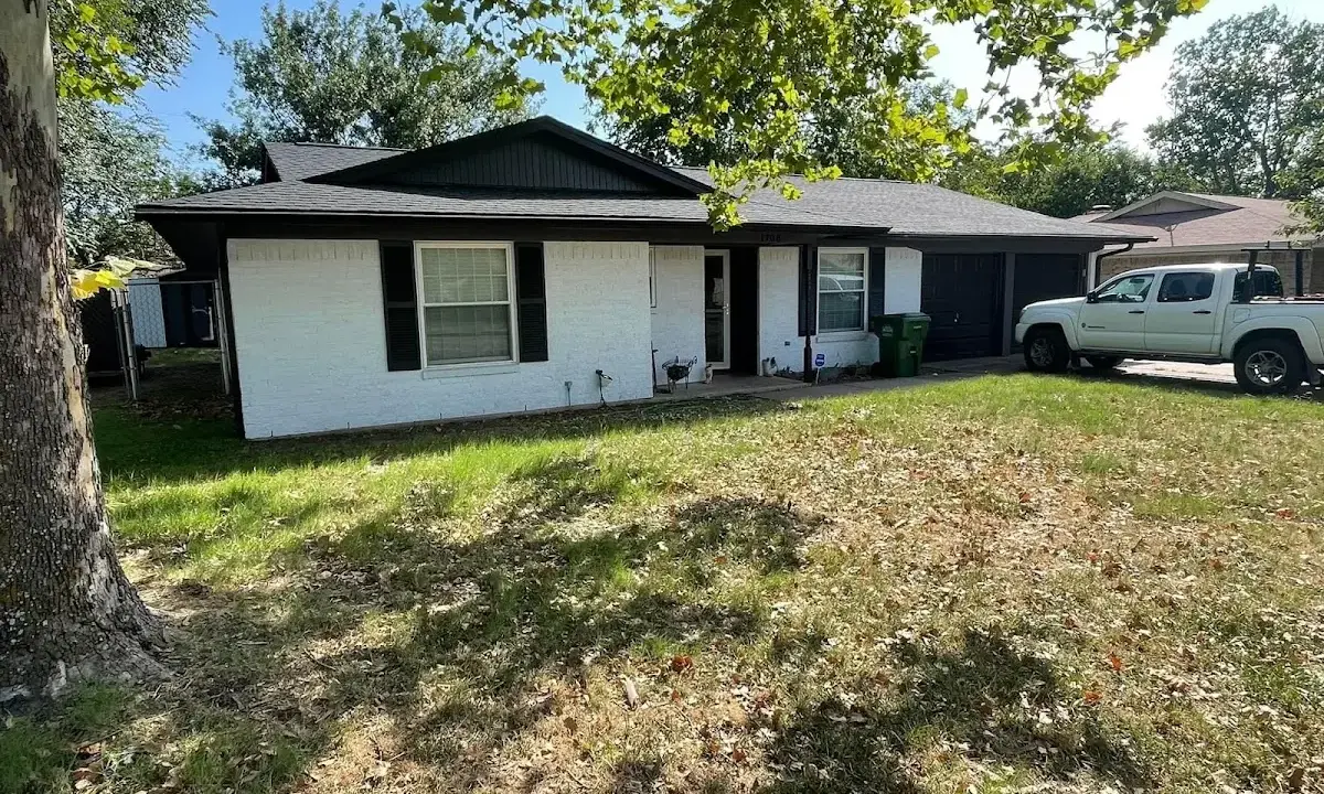 Professional roofing crew working on a residential roof in Orange